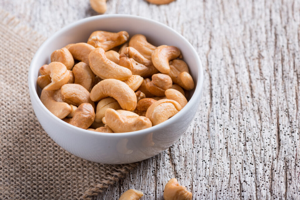 Roasted Cashew Nuts On Rustic Wood counter, nut flavors without allergens