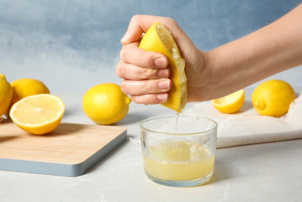 squeezing lemons, natural lemon flavor