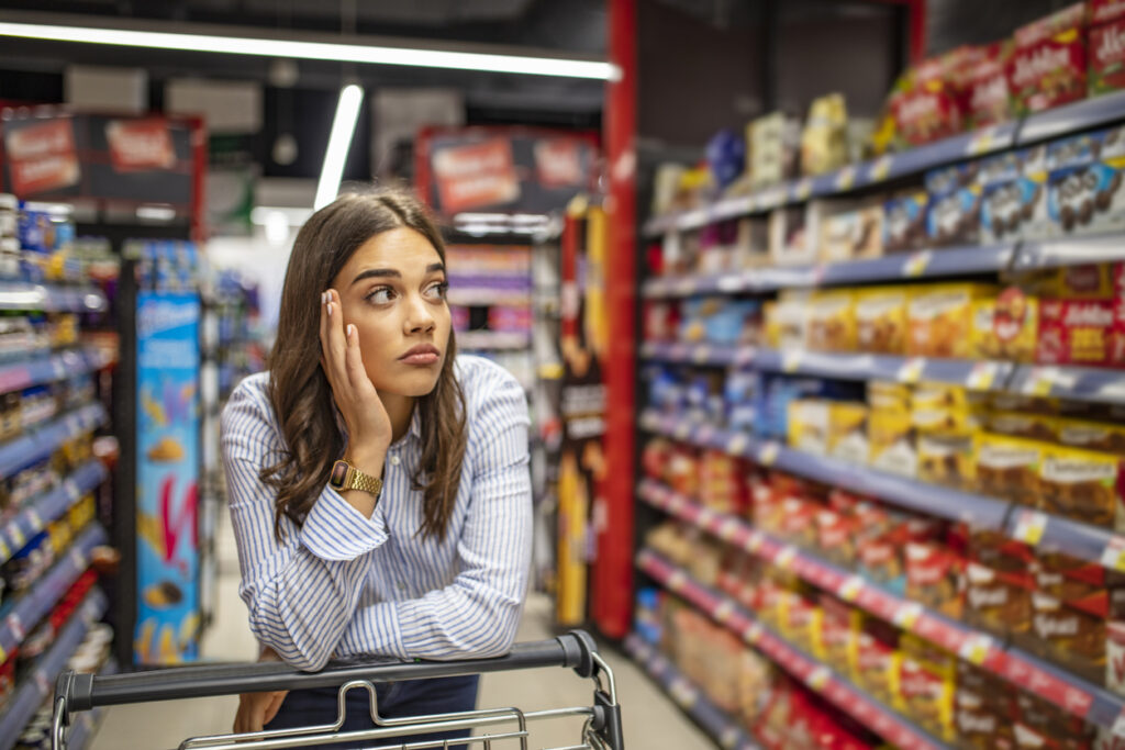 Looking At Supermarket Shelf