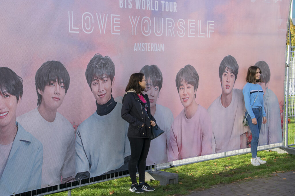 Taking Pictures At A Billboard With The Bts Group