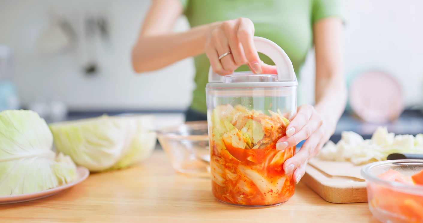 Asian Woman Storing Kimchi