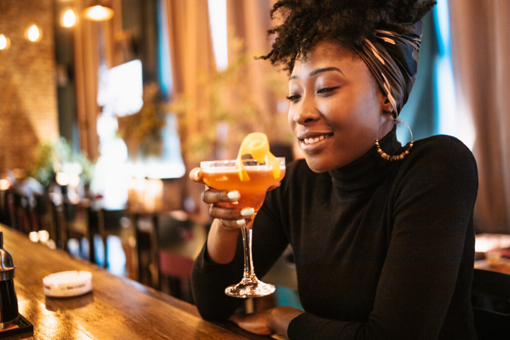 African Woman Drinking Cocktail
