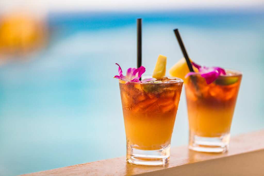 Hawaii Mai Tai Drinks On Waikiki Beach Swimming Pool Bar Travel Vacation In Honolulu, Hawaii. Alcohol Cocktails With Ocean View, Luau Party Nightlife At Club.